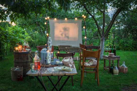 Outdoor movie theater in backyard. 