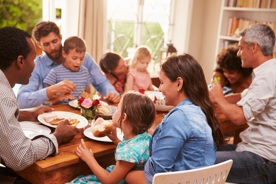 family enjoying a meal together at table