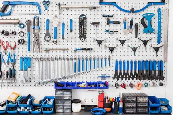 Tools organized on a pegboard in a garage. 