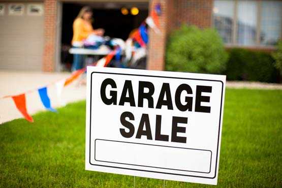 garage sale sign in yard.