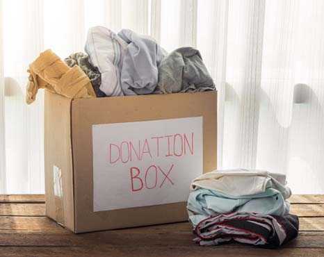 box labeled donation box with clothes