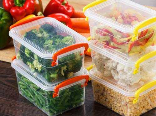 Different foods organized into separate food storage containers. 