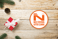 Ned Stevens Gutter Cleaning® logo next to a wrapped gift.