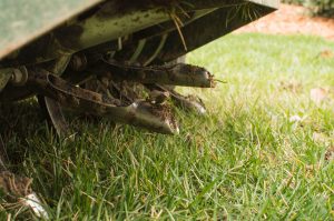 Tines from Ride On Aerator that Aerate the Grass for Lawn Care Services