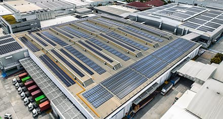commercial building with solar panels on roof