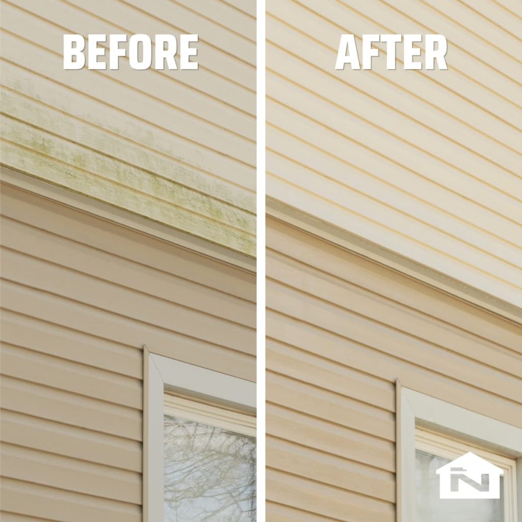 Soft wash treatment being applied to residential vinyl siding to remove algae and stains